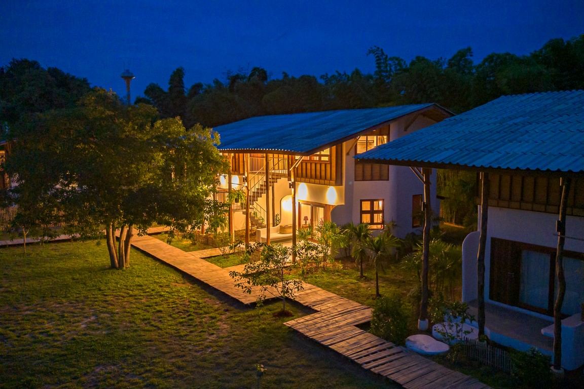 Bamboo Nest @ SangGaDee at dusk, lights on across the gardens