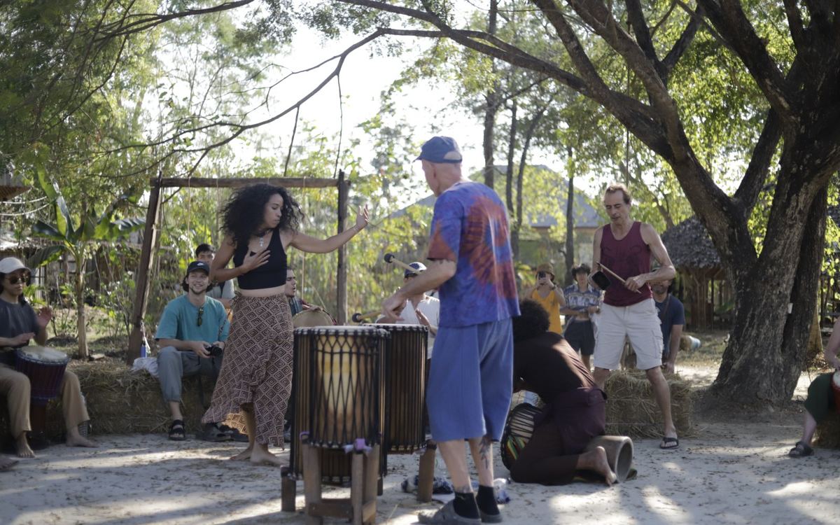 Drum circle under the trees at the market