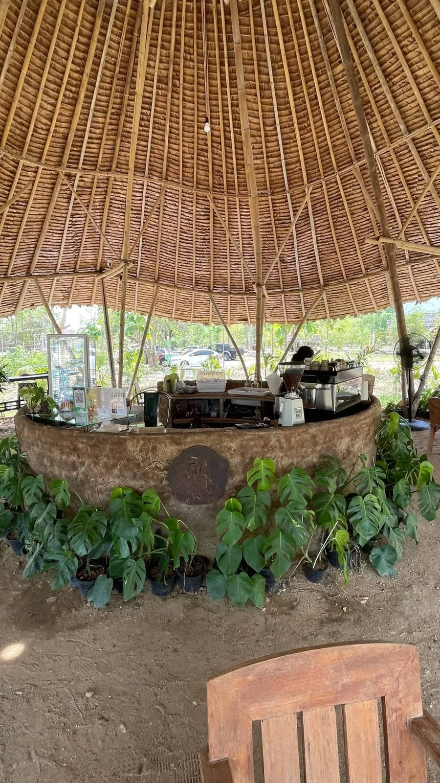 The earthen counter and bamboo-domed roof of the Din Cafe stall