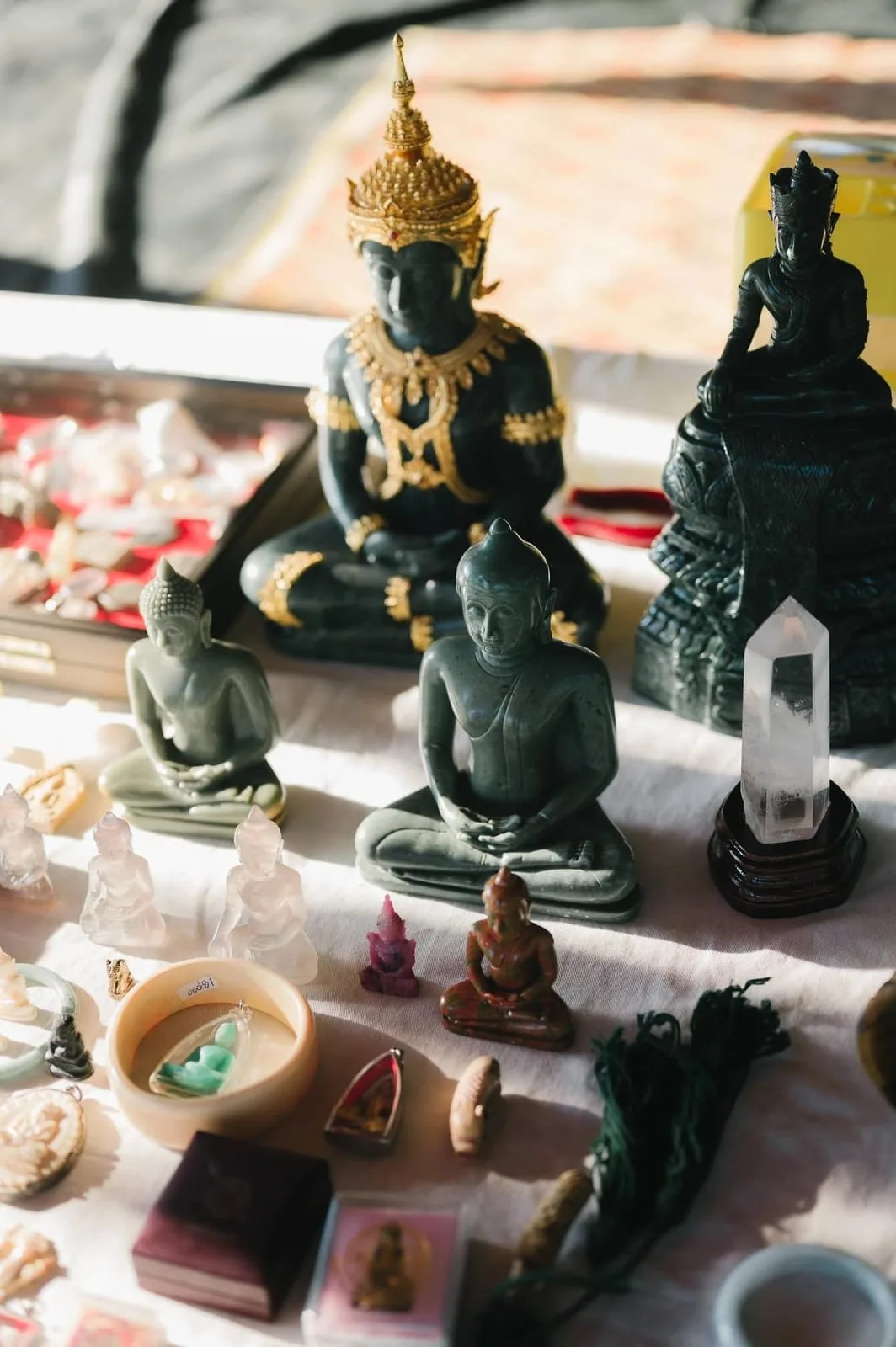 Carved amulets and gemstone figures at the Sala-Thong stall